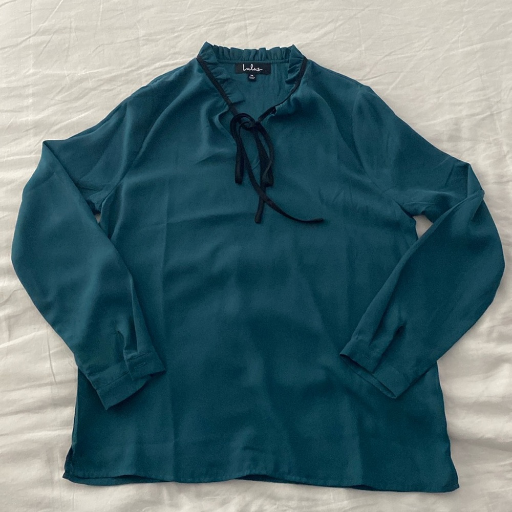 Lulu’s green blouse